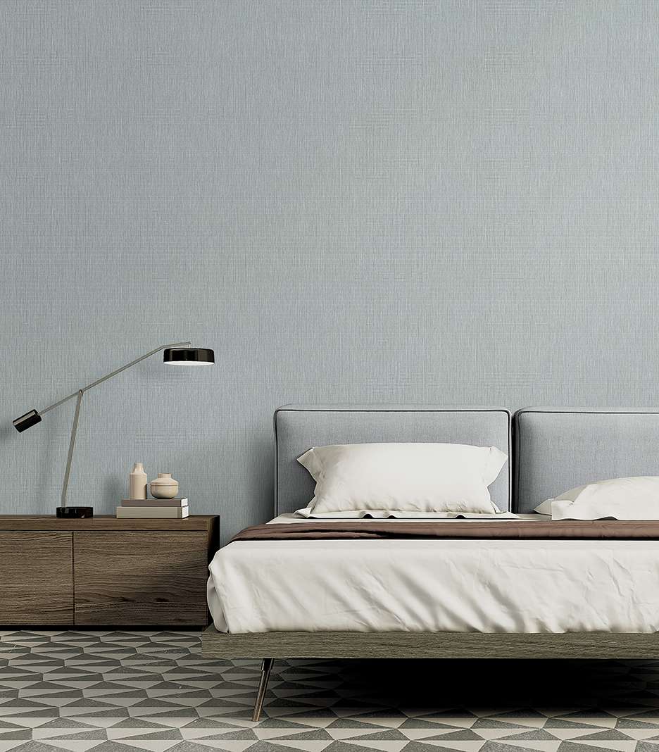 Trang trí phòng ngủ nhỏ bằng mẫu giấy dán tường trơn màu xanh nhẹ